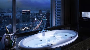 Combined shower/bathtub, deep-soaking bathtub, hair dryer, bathrobes