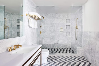Skyline Penthouse | Bathroom | Shower, rainfall showerhead, designer toiletries, hair dryer at The Betsy - South Beach