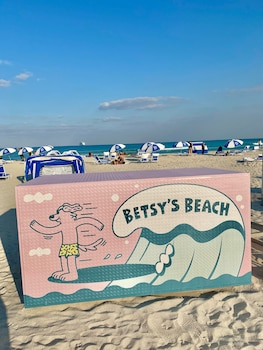On the beach, white sand, beach cabanas, sun loungers at The Betsy - South Beach