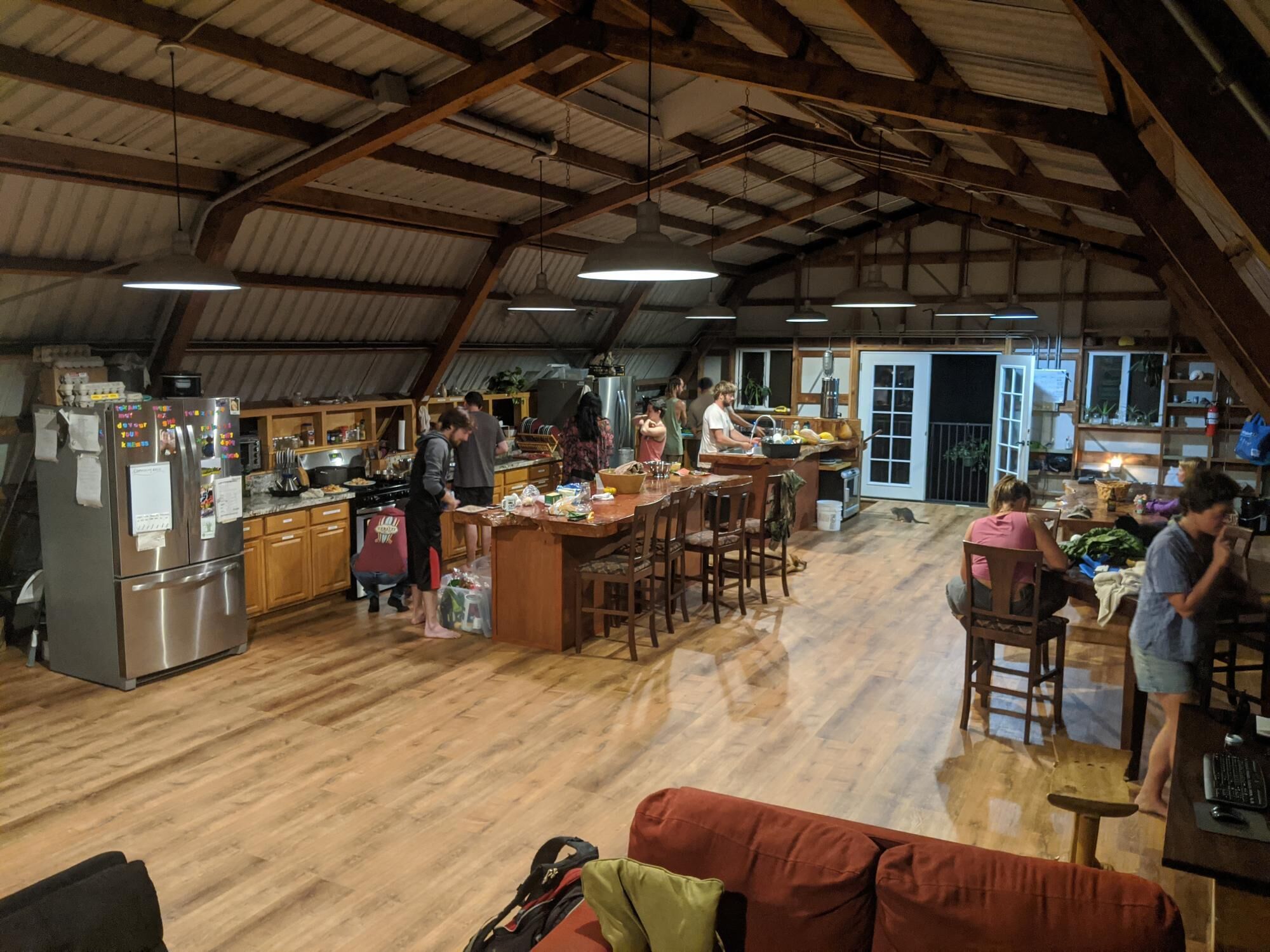 A spacious kitchen with wooden cabinets and a stainless steel refrigerator.