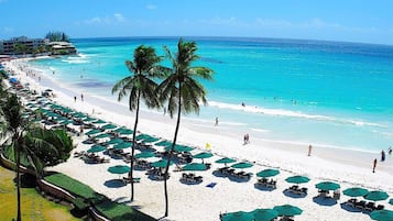 On the beach, white sand, free beach cabanas, sun-loungers