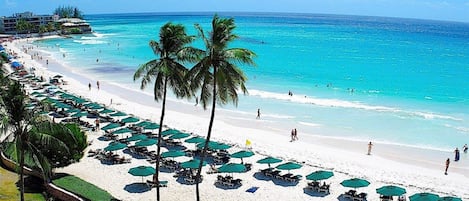 On the beach, white sand, free beach cabanas, sun-loungers