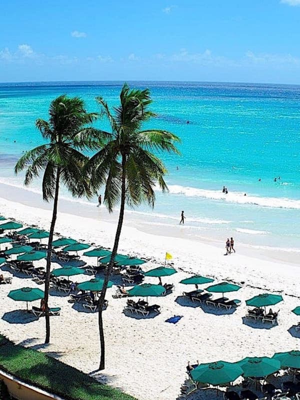 On the beach, white sand, free beach cabanas, sun loungers