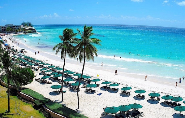 On the beach, white sand, free beach cabanas, sun-loungers