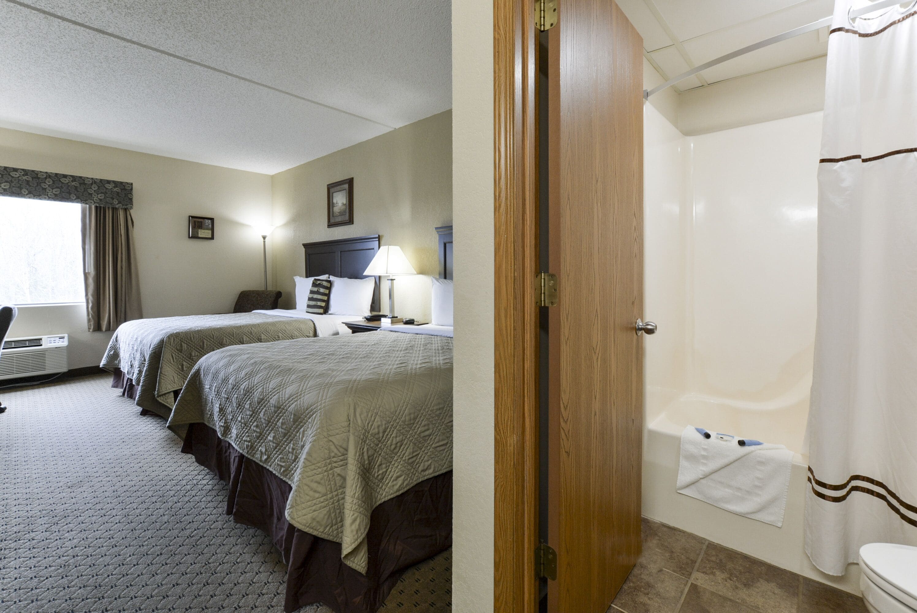 deluxe room, 2 queen beds | premium bedding, desk, laptop workspace, iron/ironing board