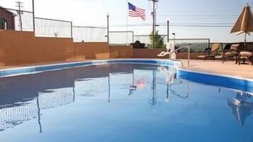 Seasonal outdoor pool, pool umbrellas, sun loungers