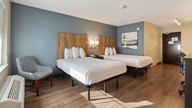 A hotel room with two beds, a chair, a desk, and a piano. - Extended Stay America Premier Suites - Union City - Dyer St. (Union City)