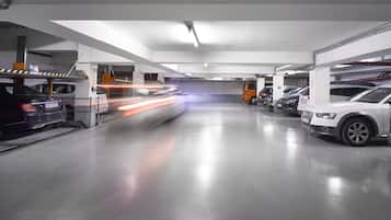 A multi-level parking garage with several cars parked.