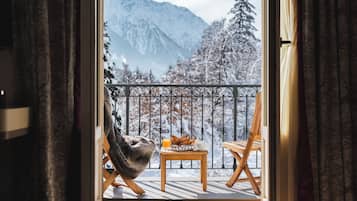 Suite junior, vistas a la montaña | 1 dormitorio y ropa de cama de alta calidad