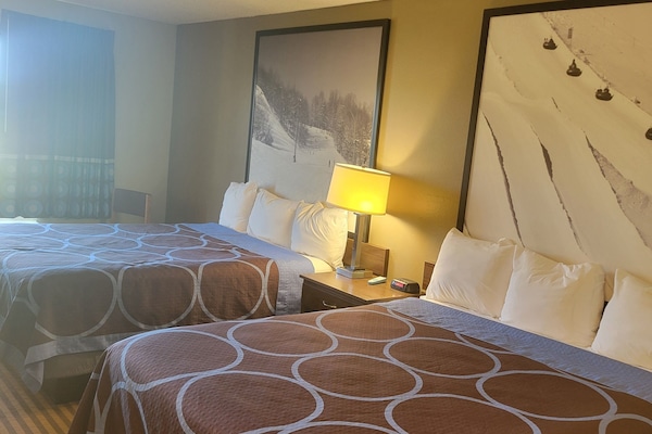 Room, 2 Queen Beds | In-room safe, desk, laptop workspace, free cribs/infant beds