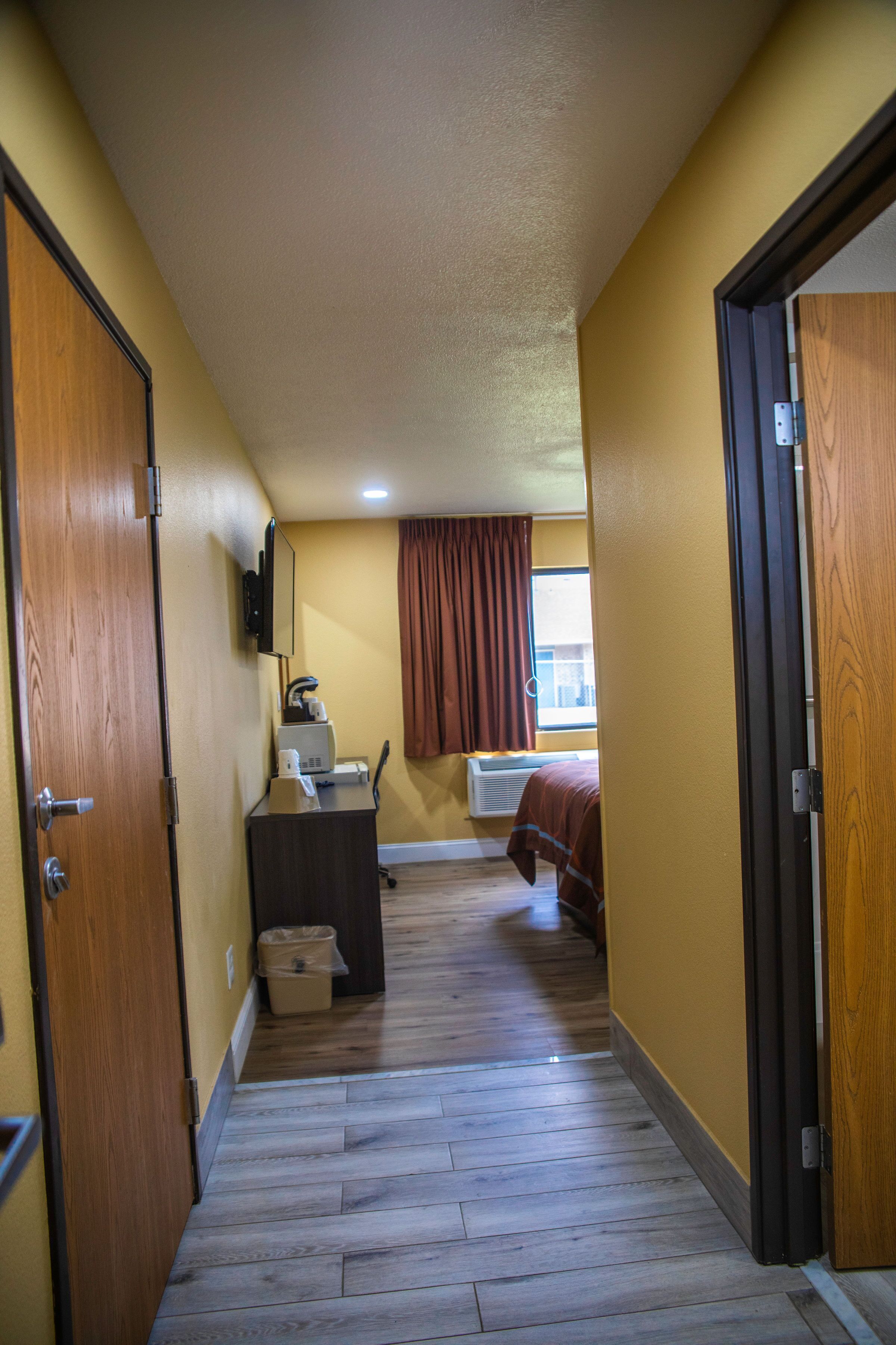 Desk, laptop workspace, blackout drapes, free cribs/infant beds