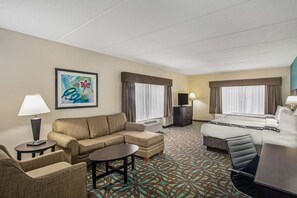 Premium bedding, desk, laptop workspace, blackout drapes