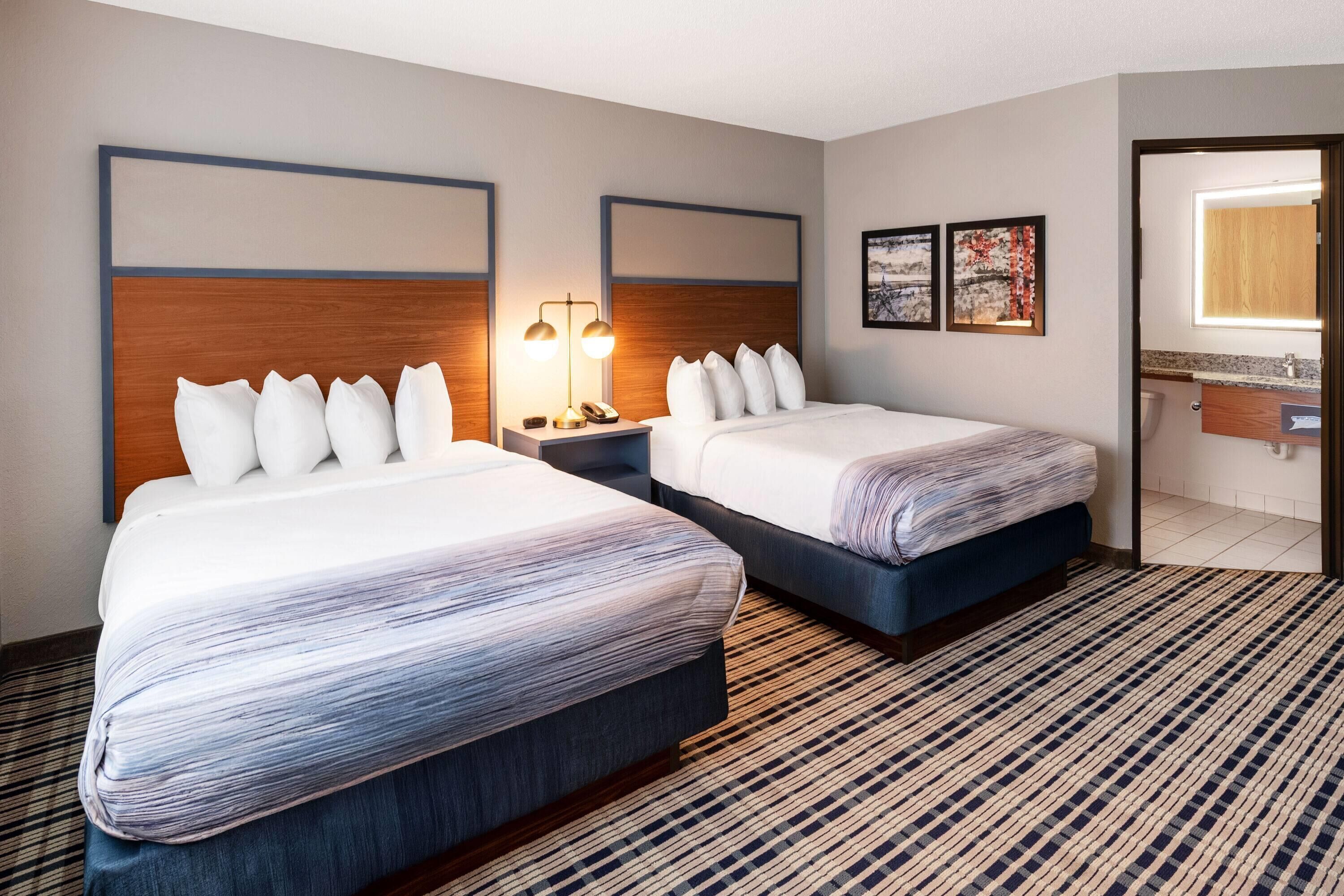 room, 2 queen beds, non smoking | desk, blackout curtains, iron/ironing board, free cots/infant beds