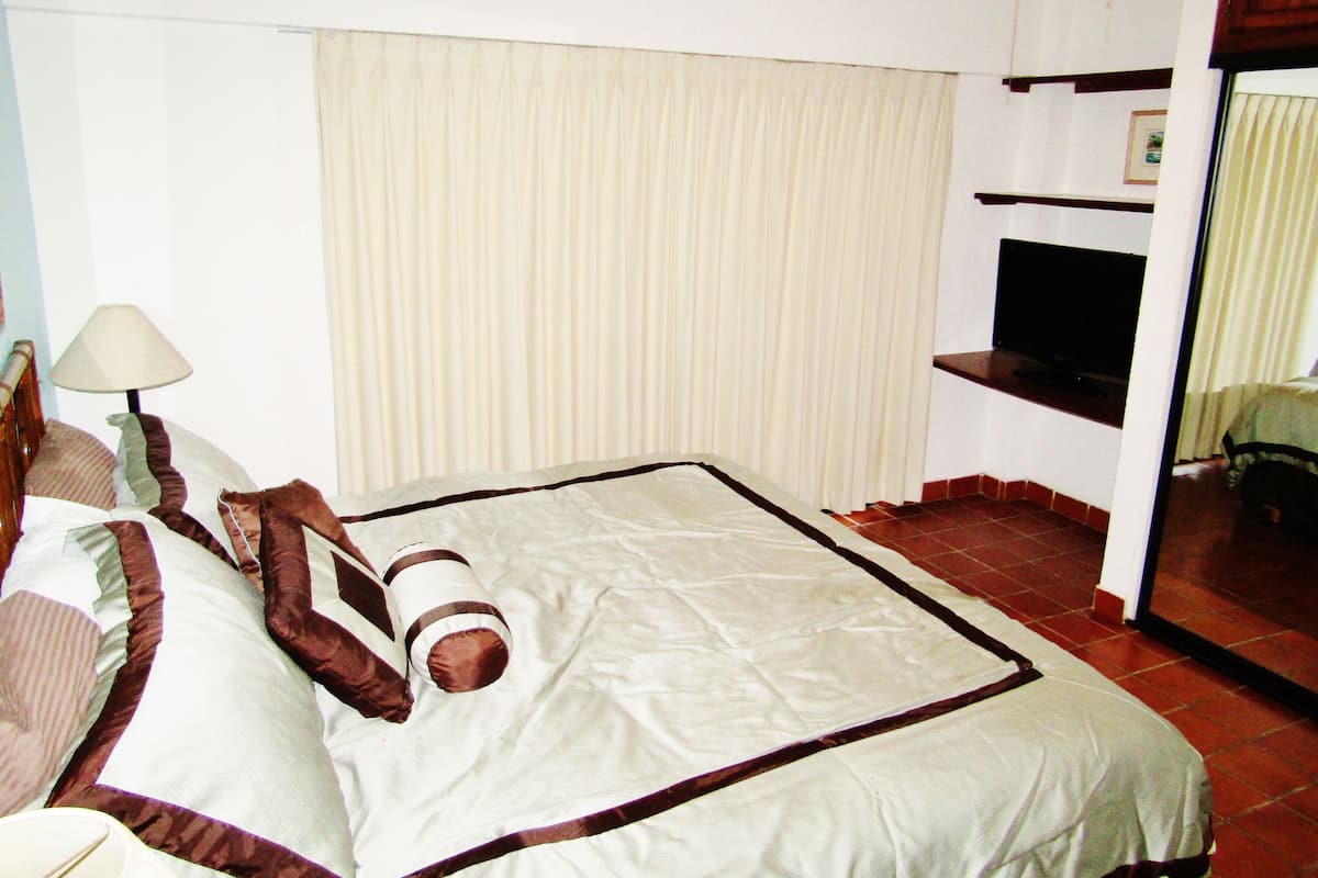 Blackout curtains, iron/ironing board, free cots/infant beds