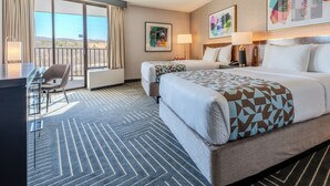 A hotel room with two beds, a desk, and a balcony with a view. - Valley Forge Casino Resort (King of Prussia)