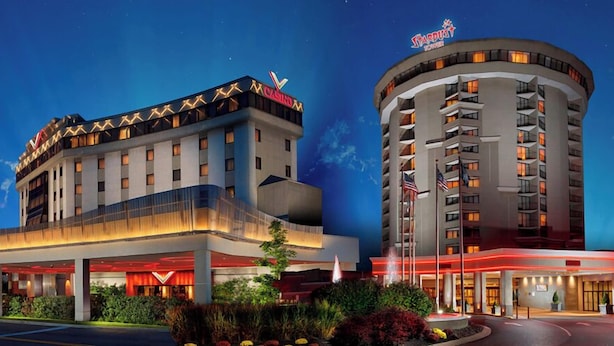 A hotel with a modern design, featuring a prominent casino sign on the top of the building. - Valley Forge Casino Resort (King of Prussia)