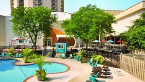 A swimming pool with lounge chairs and a food truck. - Valley Forge Casino Resort (King of Prussia)