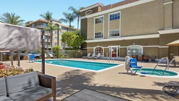 Outdoor pool, open 7 AM to 10 PM, pool umbrellas, sun loungers