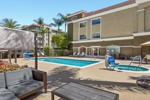 Outdoor pool, open 7 AM to 10 PM, pool umbrellas, sun loungers