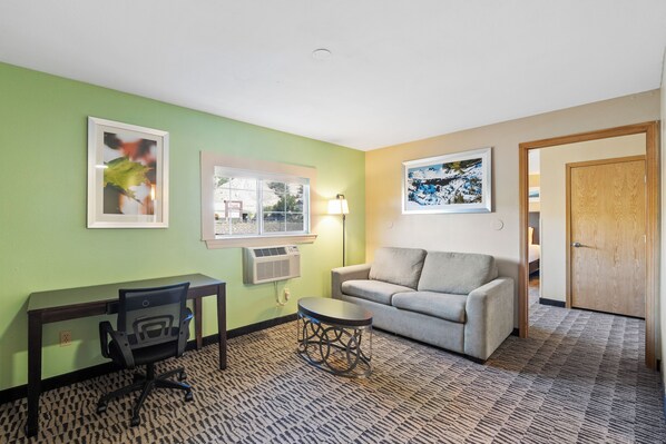 One-King - One Bedroom Suite | Living area | 32-inch flat-screen TV with cable channels, TV