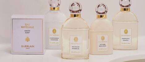A set of Guerlain perfume bottles and a soap box.