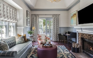 One-Bedroom Cottage Suite - Pet Friendly | Living area | Flat-screen TV, fireplace