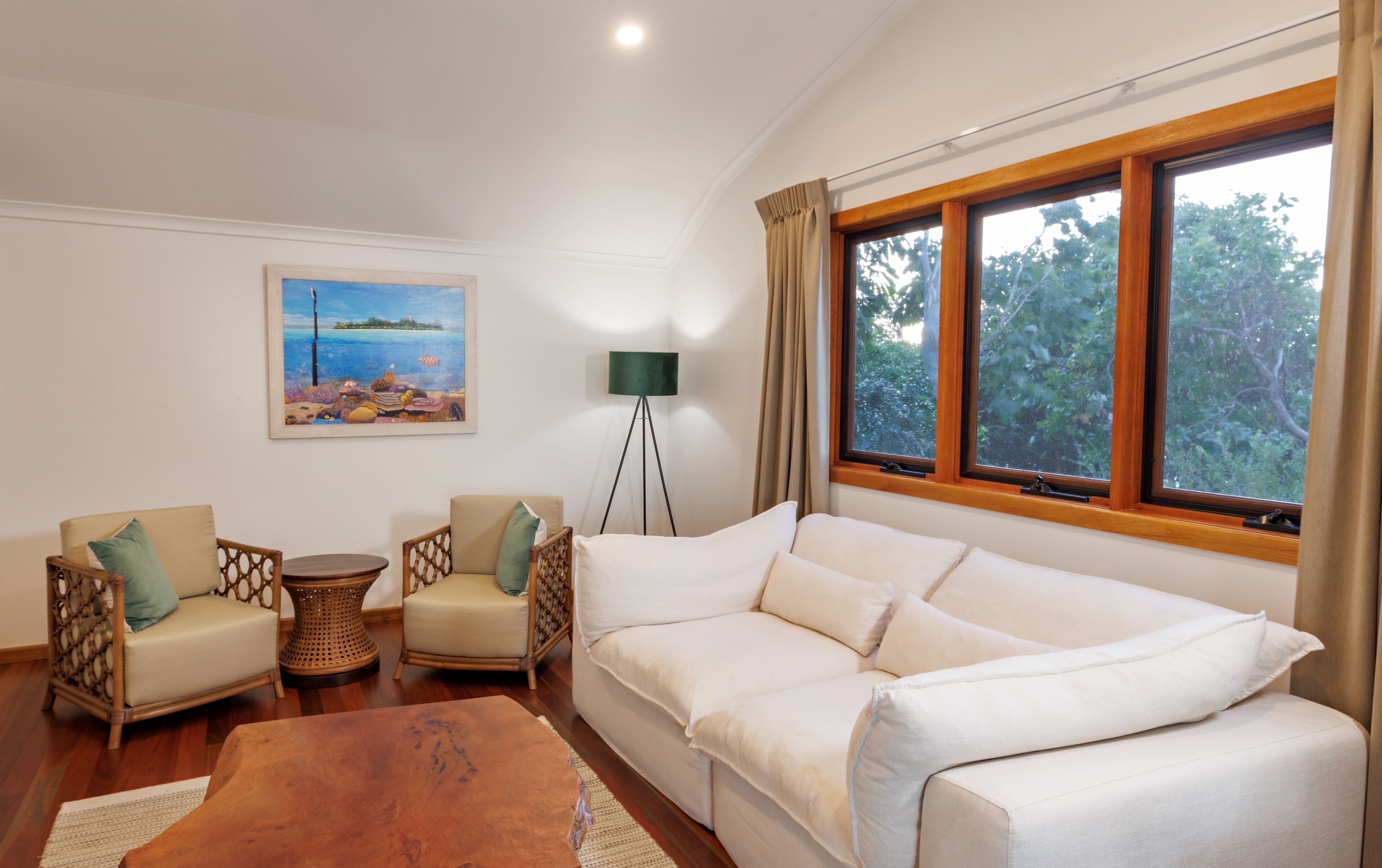 birdwing suite | living area | flat-screen tv, dvd player, books, video library