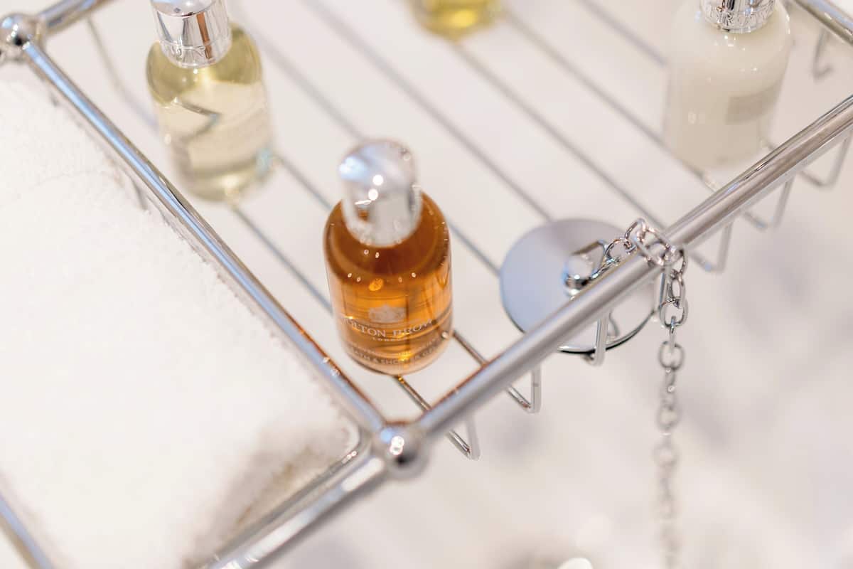 designer toiletries, hair dryer, bathrobes, slippers