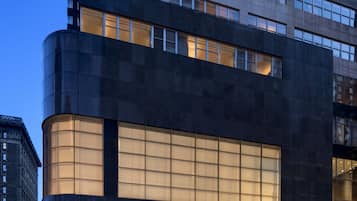 Stunning hotel building with a striking facade featuring a combination of dark and light materials.