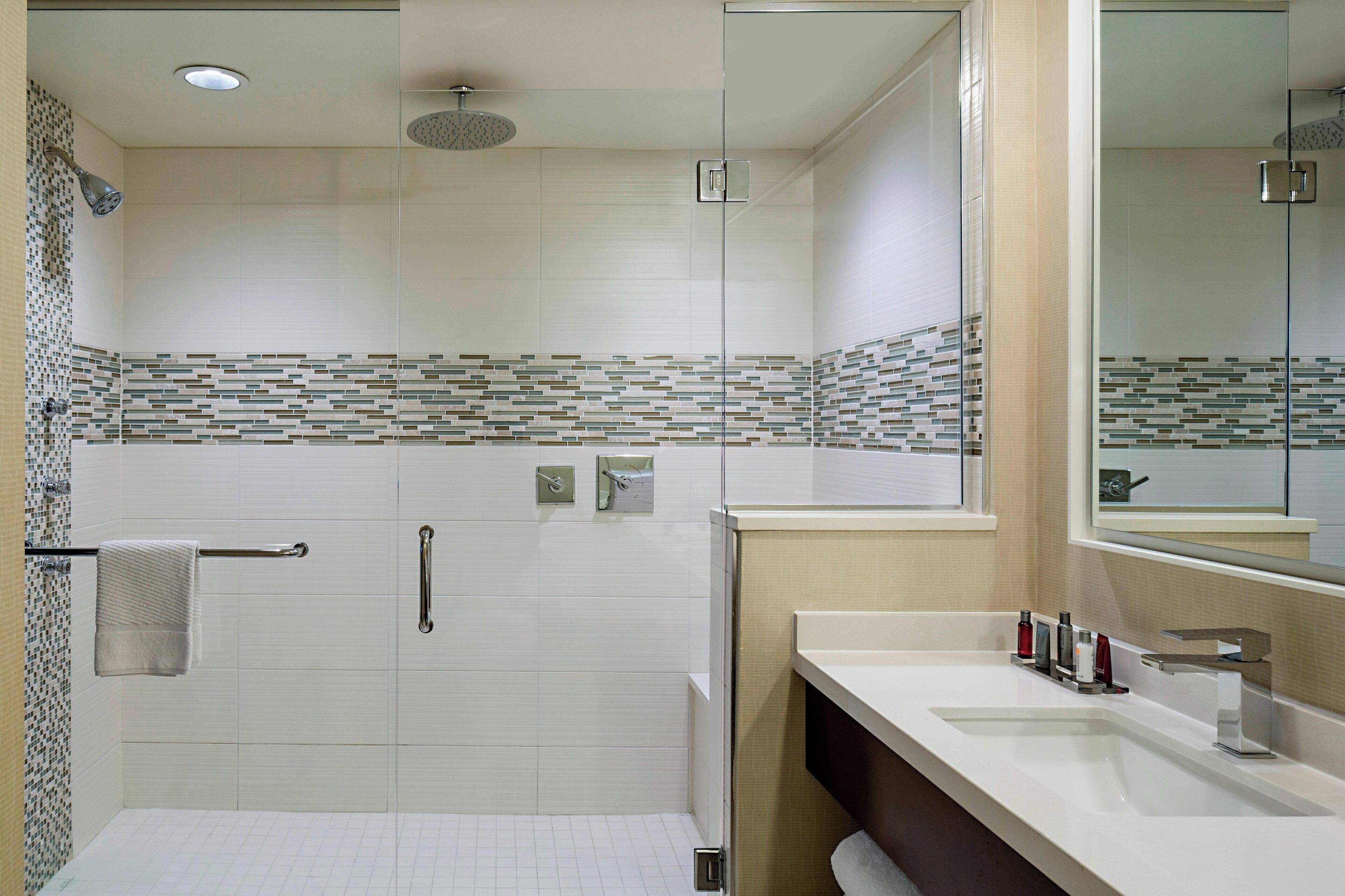 combined shower/bathtub, rainfall showerhead, designer toiletries