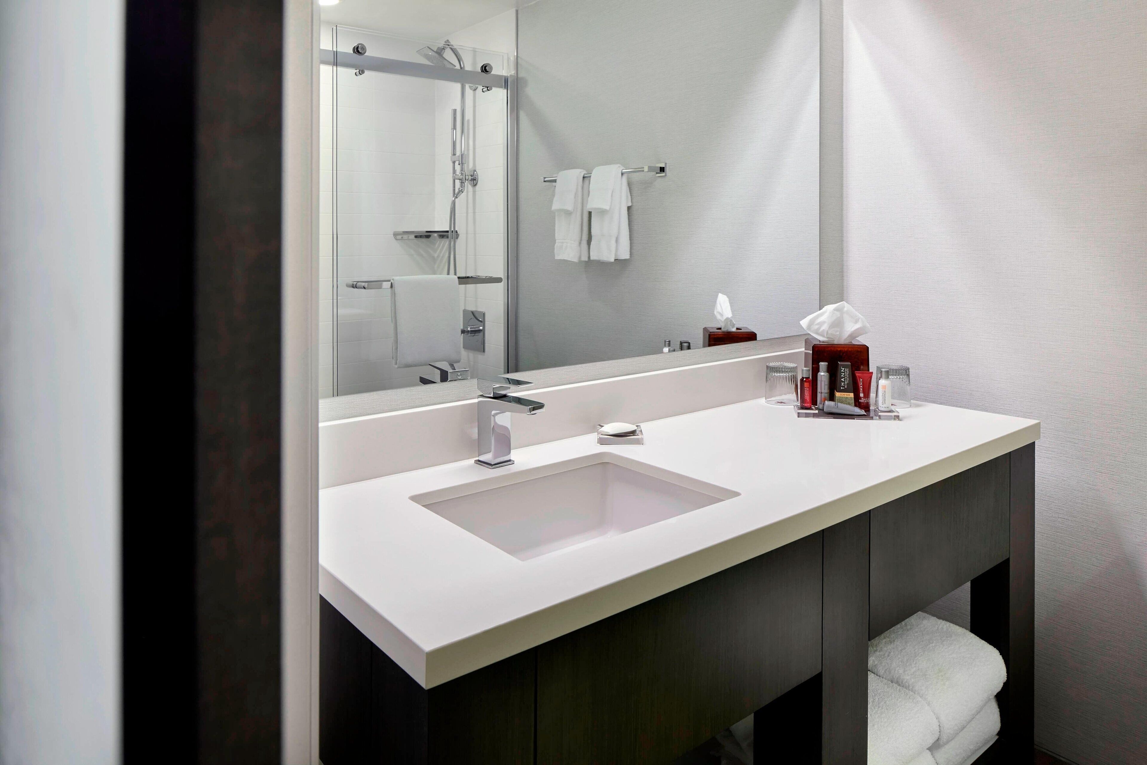 combined shower/bathtub, rainfall showerhead, designer toiletries