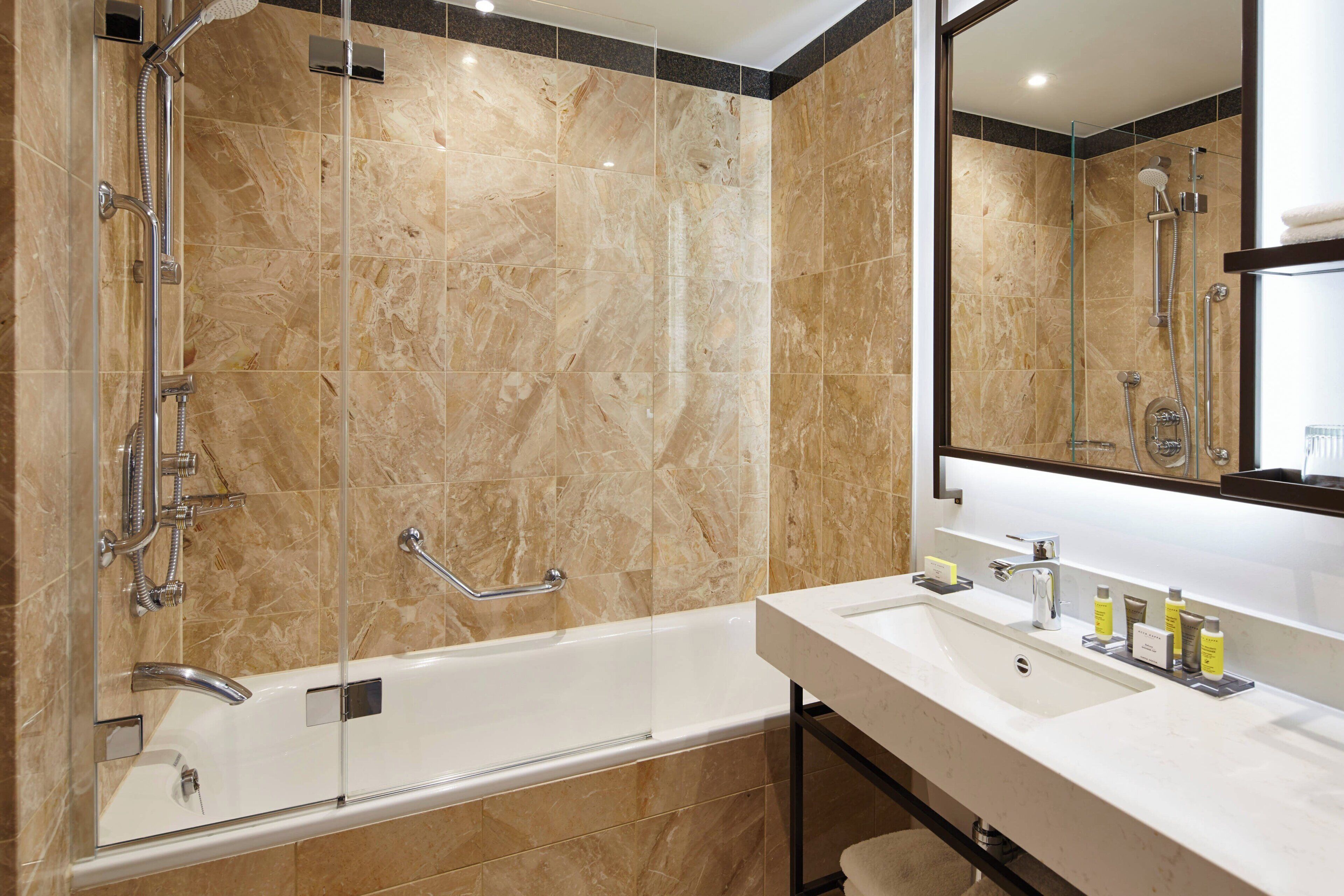 superior room, 1 king bed (view) | bathroom | combined shower/bathtub, eco-friendly toiletries, hair dryer, bathrobes