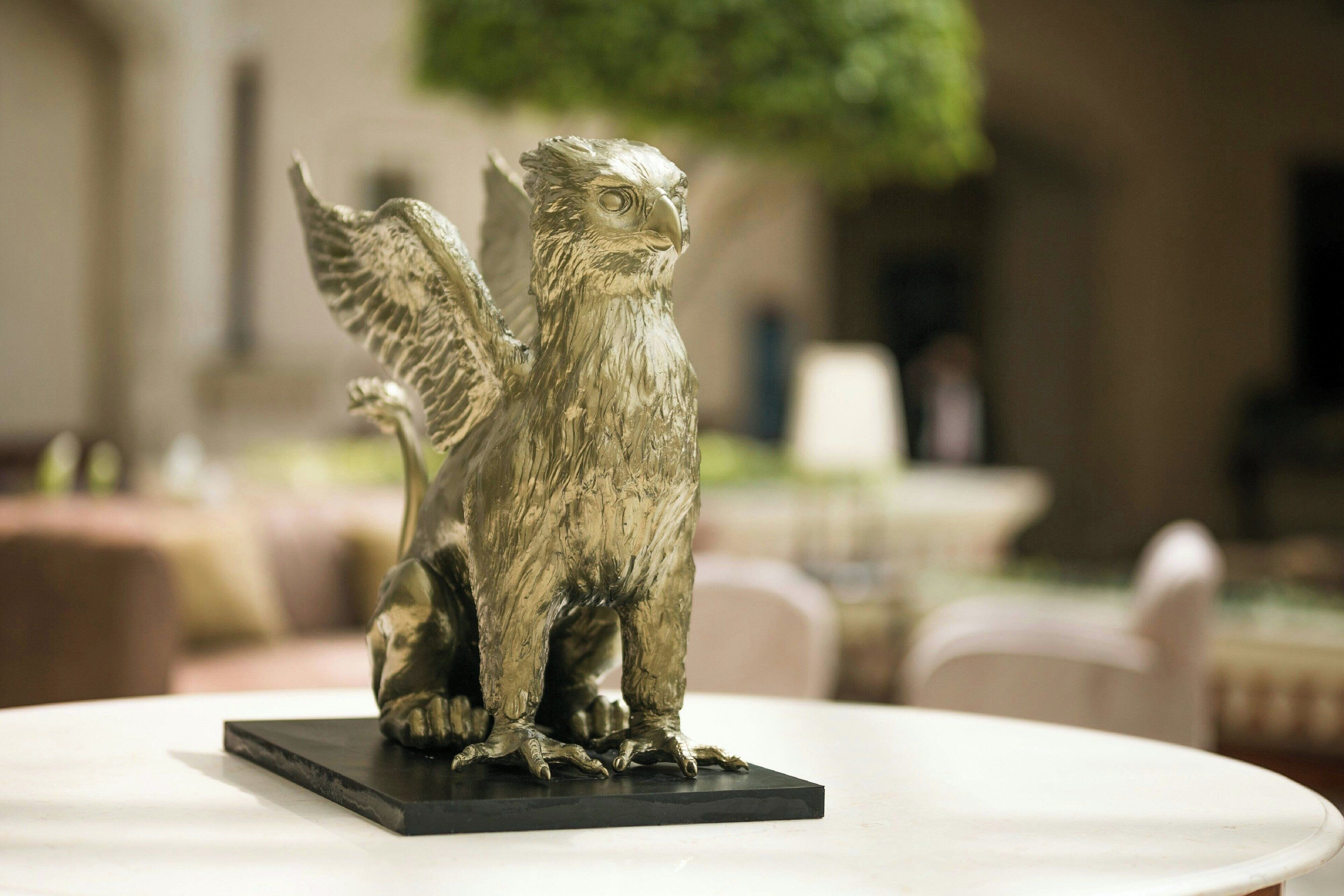 A bronze eagle statue on a black base.