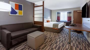 Suite, 1 King Bed, Non Smoking | Desk, laptop workspace, blackout drapes, soundproofing