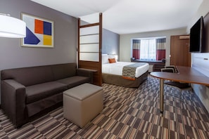 Suite, 1 King Bed, Non Smoking | Desk, laptop workspace, blackout drapes, soundproofing