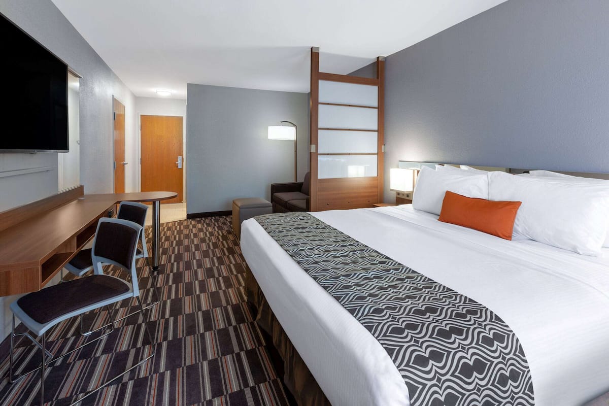 Suite, 1 King Bed, Non Smoking | Desk, laptop workspace, blackout drapes, soundproofing