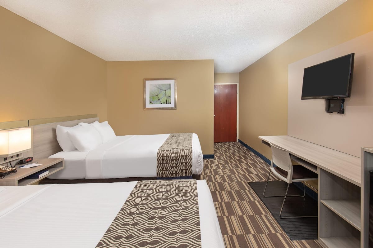 Desk, blackout drapes, iron/ironing board, free cribs/infant beds