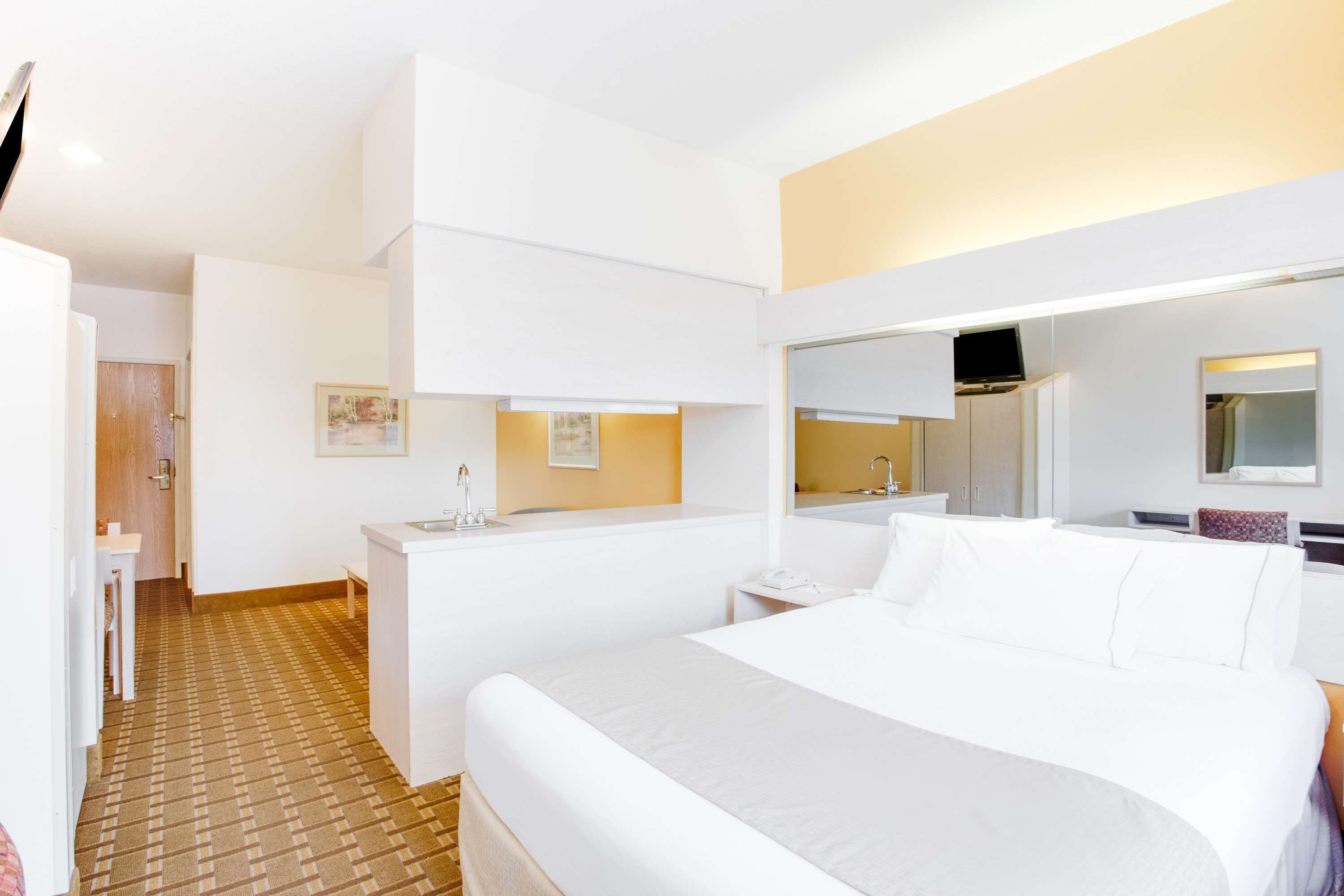 desk, laptop workspace, blackout curtains, iron/ironing board