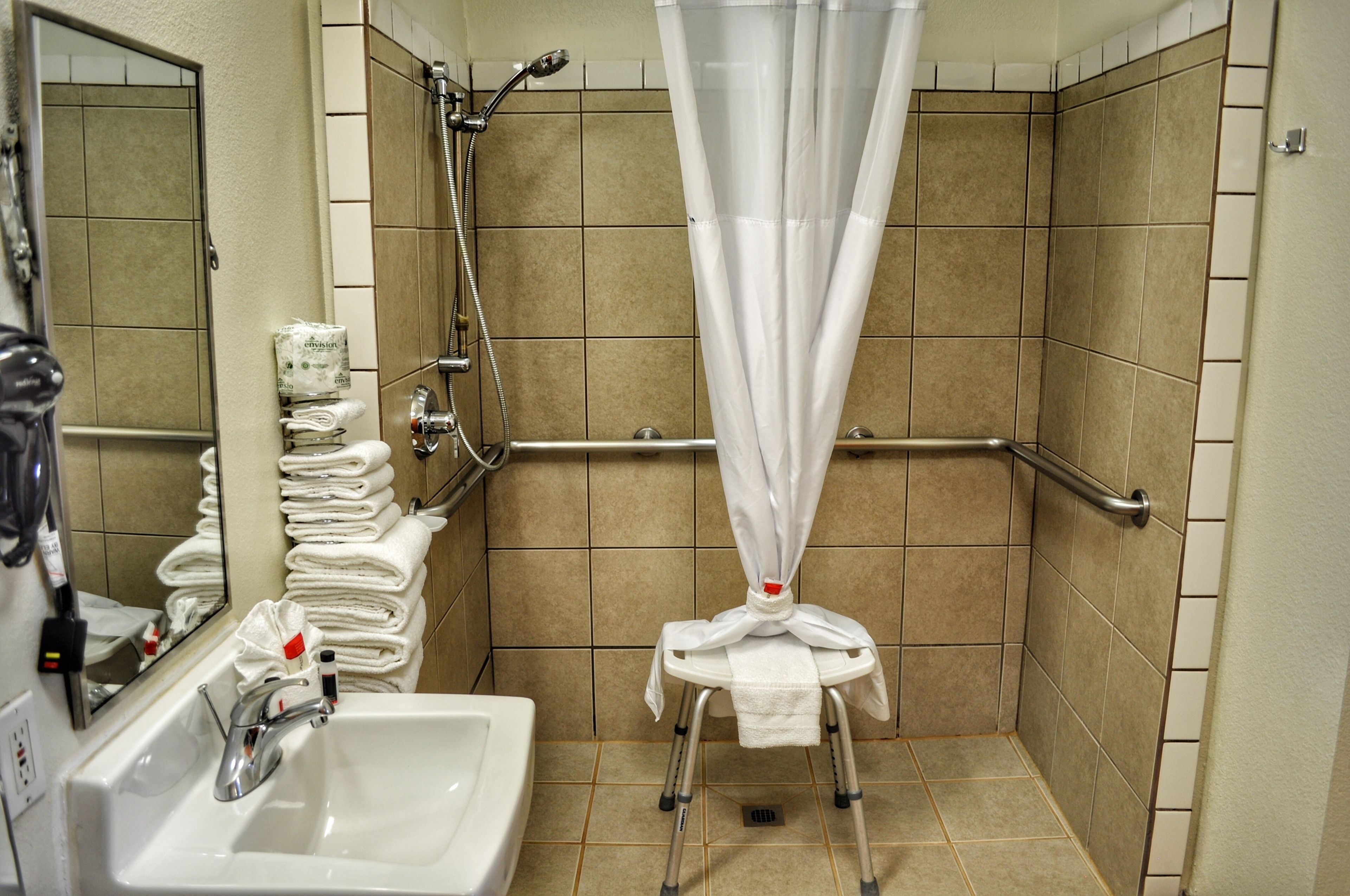 room, 1 king bed, accessible, roll-in shower, non smoking | bathroom | combined shower/bathtub, deep-soaking bathtub, rainfall showerhead