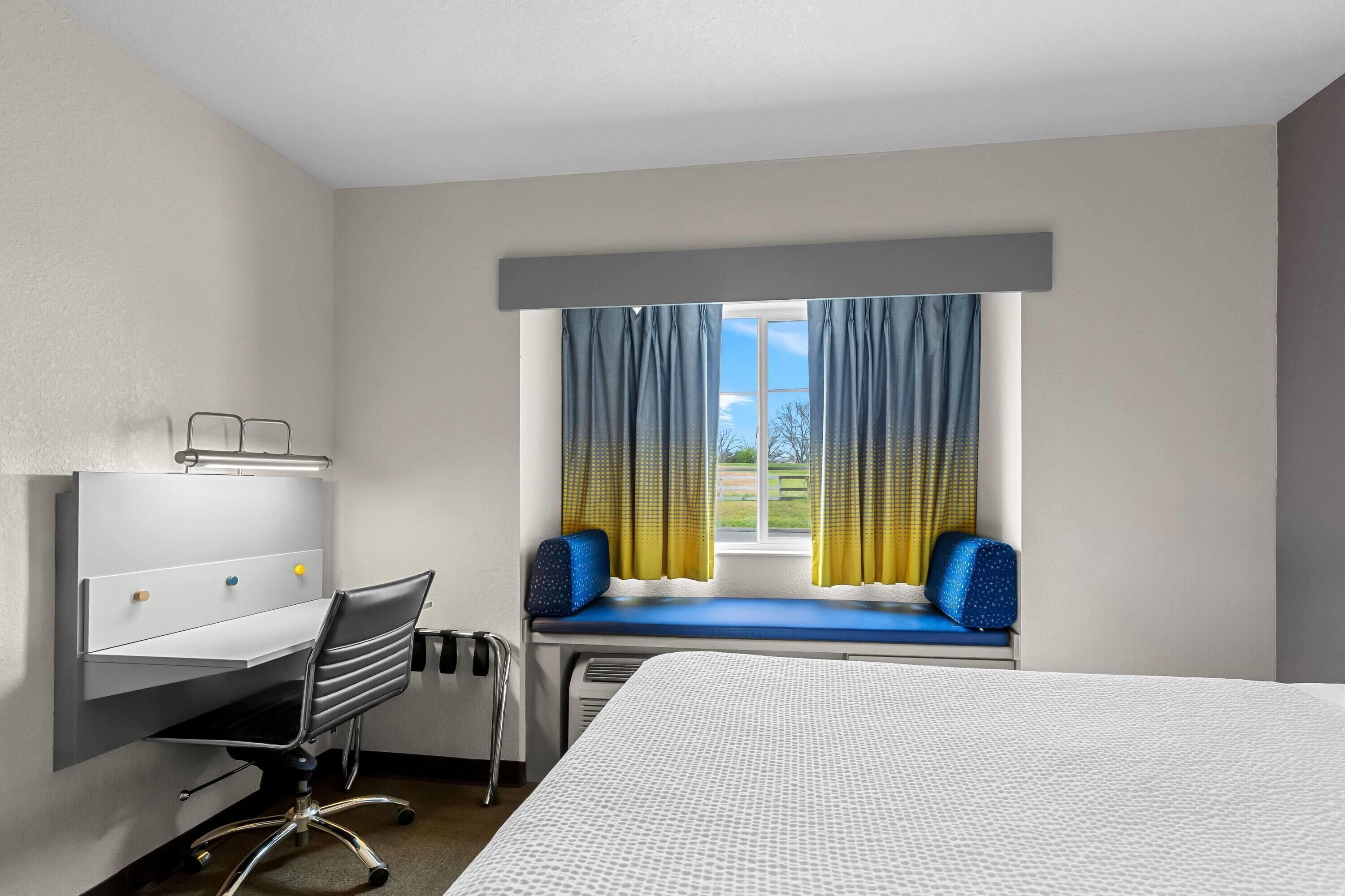 Premium bedding, individually furnished, desk, laptop workspace