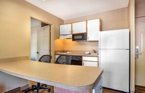 Full-size fridge, microwave, stovetop, coffee/tea maker
