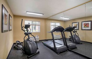 Stay fit on the go with our fully equipped gym featuring exercise bikes and treadmills.