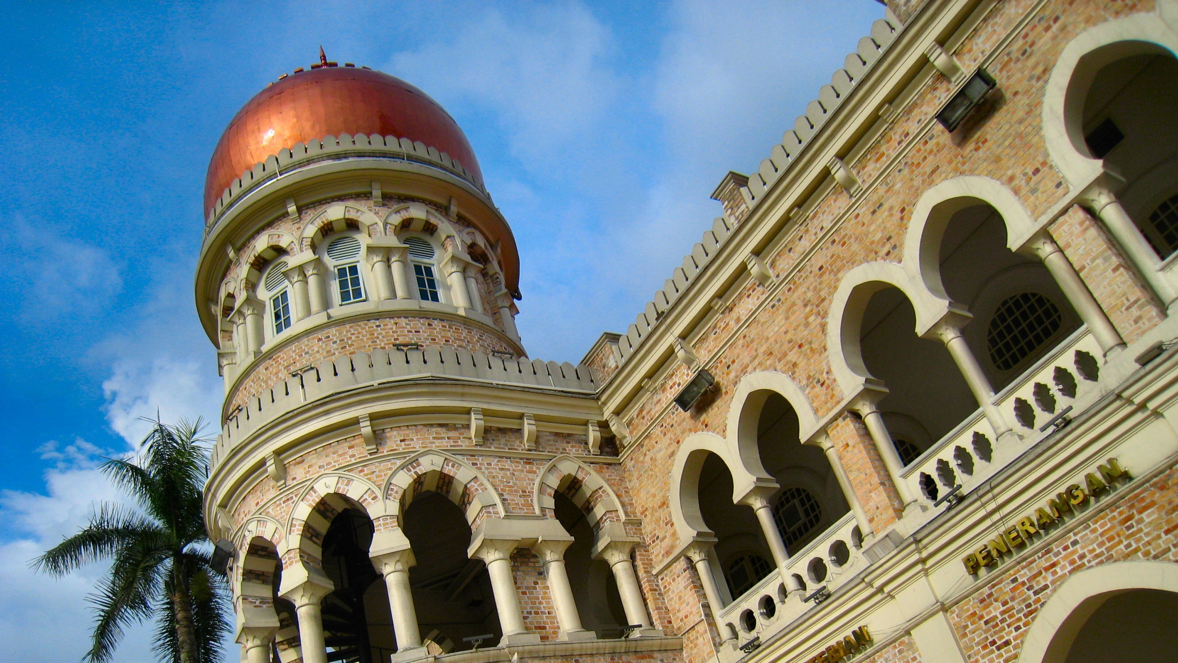 A historical building with a prominent dome and arched windows.
