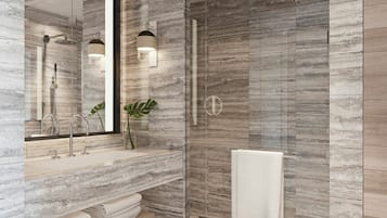 A modern bathroom with a marble wall, a large mirror, a shower, and a sink with a towel rack.