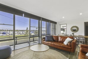 Three Bedroom Apartment - Waterview | Living area | TV - Bellevue on the Lakes (Lakes Entrance)