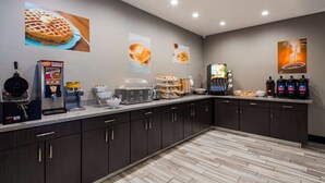 A modern kitchen area with waffle makers, a coffee station, and a toaster. - SureStay Plus Hotel by Best Western Point Richmond (Richmond)