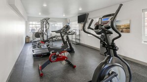 A gym with stationary bikes, a treadmill, and weight machines. - Comfort Inn & Suites Louisville Airport Fair & Expo (Louisville)