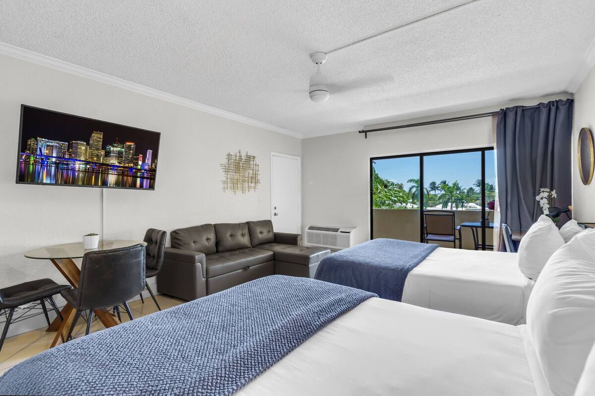 Superior Double Queen W/ Balcony & Sofa | Premium bedding, in-room safe, blackout drapes, iron/ironing board