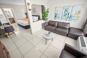 Junior Suite King w/ Kitchenette & Sofa Bed | Premium bedding, in-room safe, blackout drapes, iron/ironing board