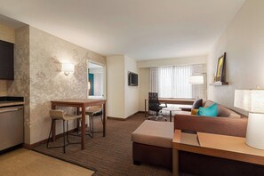 Premium bedding, desk, laptop workspace, blackout drapes